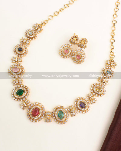 Gold-plated Navaratnalu short necklace set with multicolor CZ stones representing nine gems and matching earrings by Dritya Jewelry.