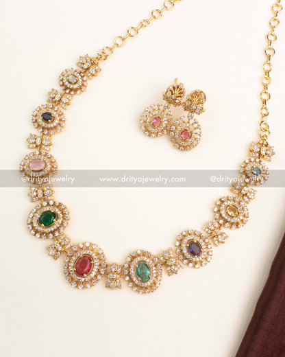 Gold-plated Navaratnalu short necklace set with multicolor CZ stones representing nine gems and matching earrings by Dritya Jewelry.