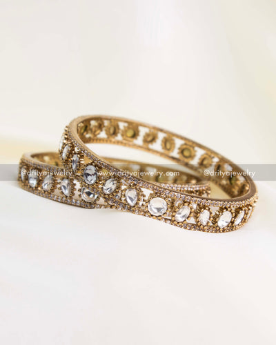 Pair of antique gold Polki Kundan bangles with uncut Moissanite-look stones.