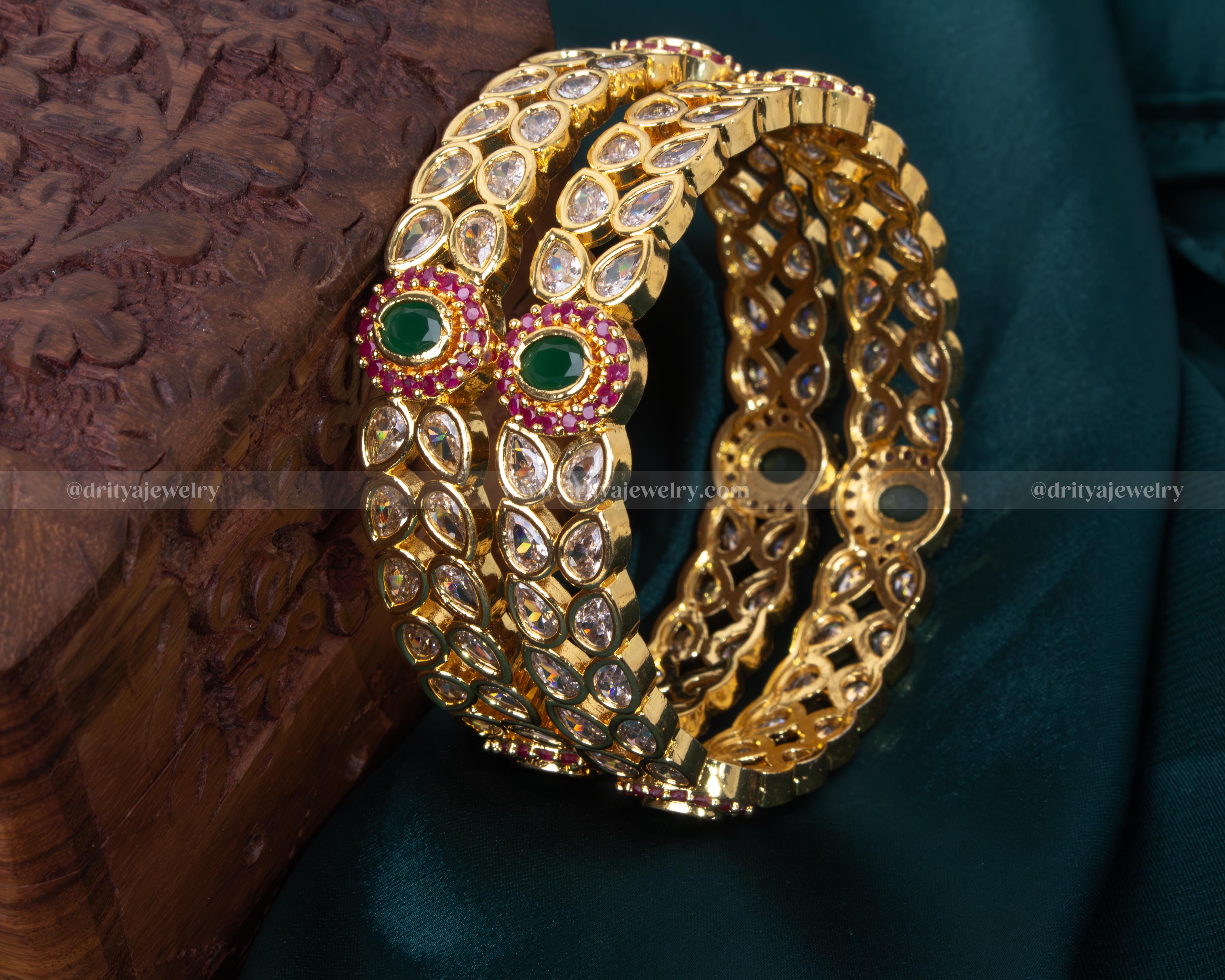 Opulent gold-plated bangle set with reverse-set CZ stones and colorful accents, perfect for weddings and formal events.