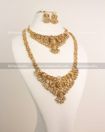 Antique gold temple jewelry combo set with Lakshmi motifs, short and long necklaces, and matching jhumkas.