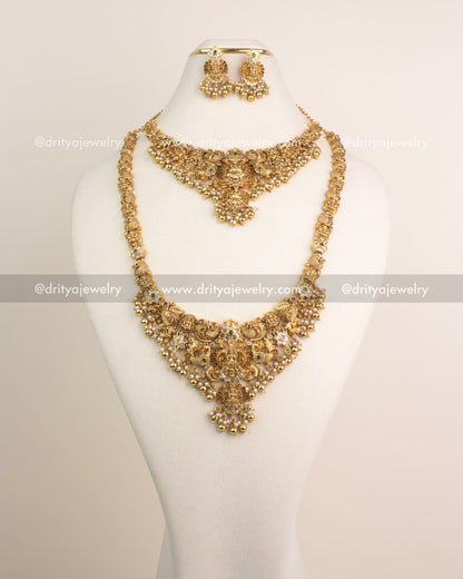 Antique gold temple jewelry combo set with Lakshmi motifs, short and long necklaces, and matching jhumkas.