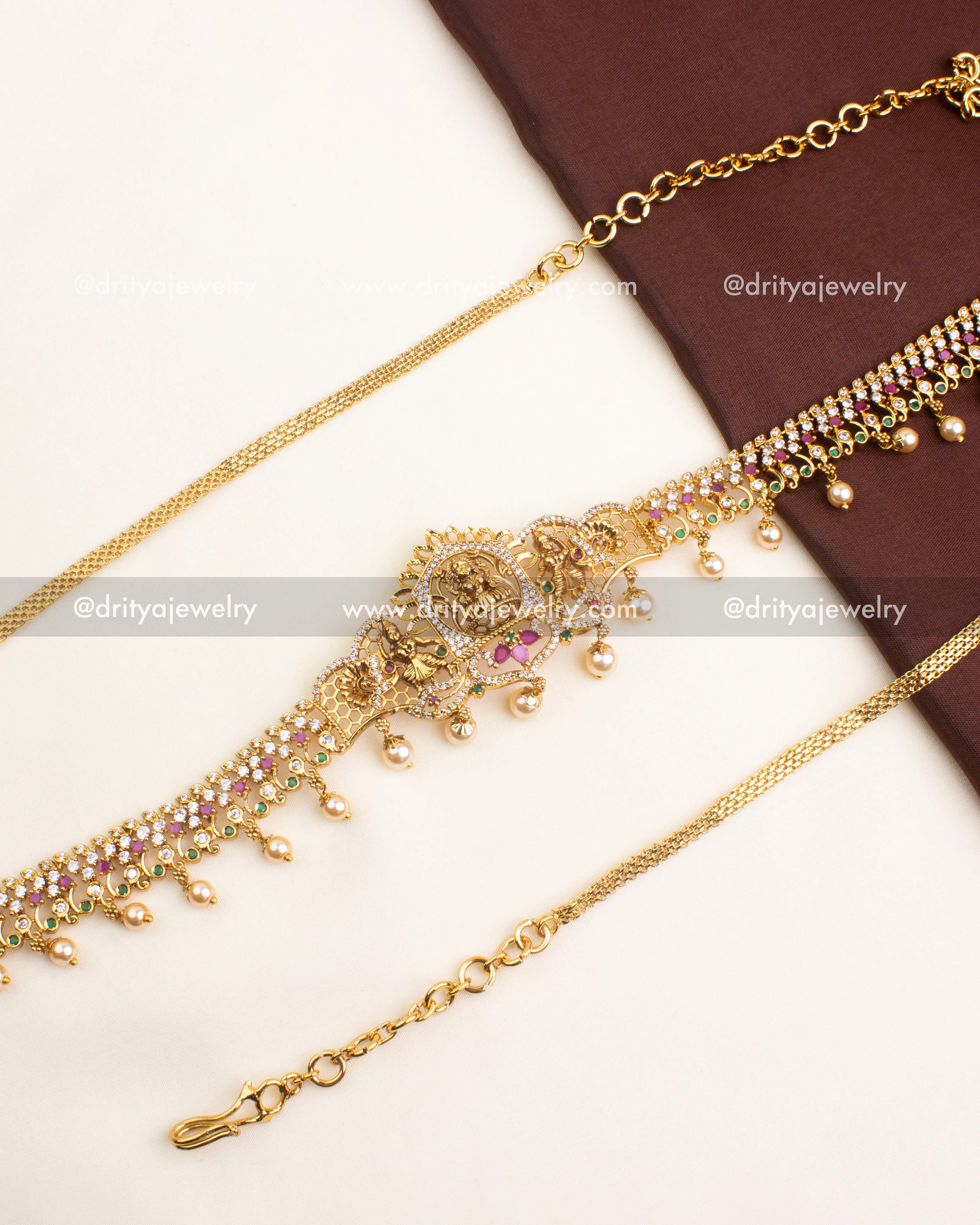 Antique temple hip chain featuring goddess motif, CZ stones, and pearl drops.
