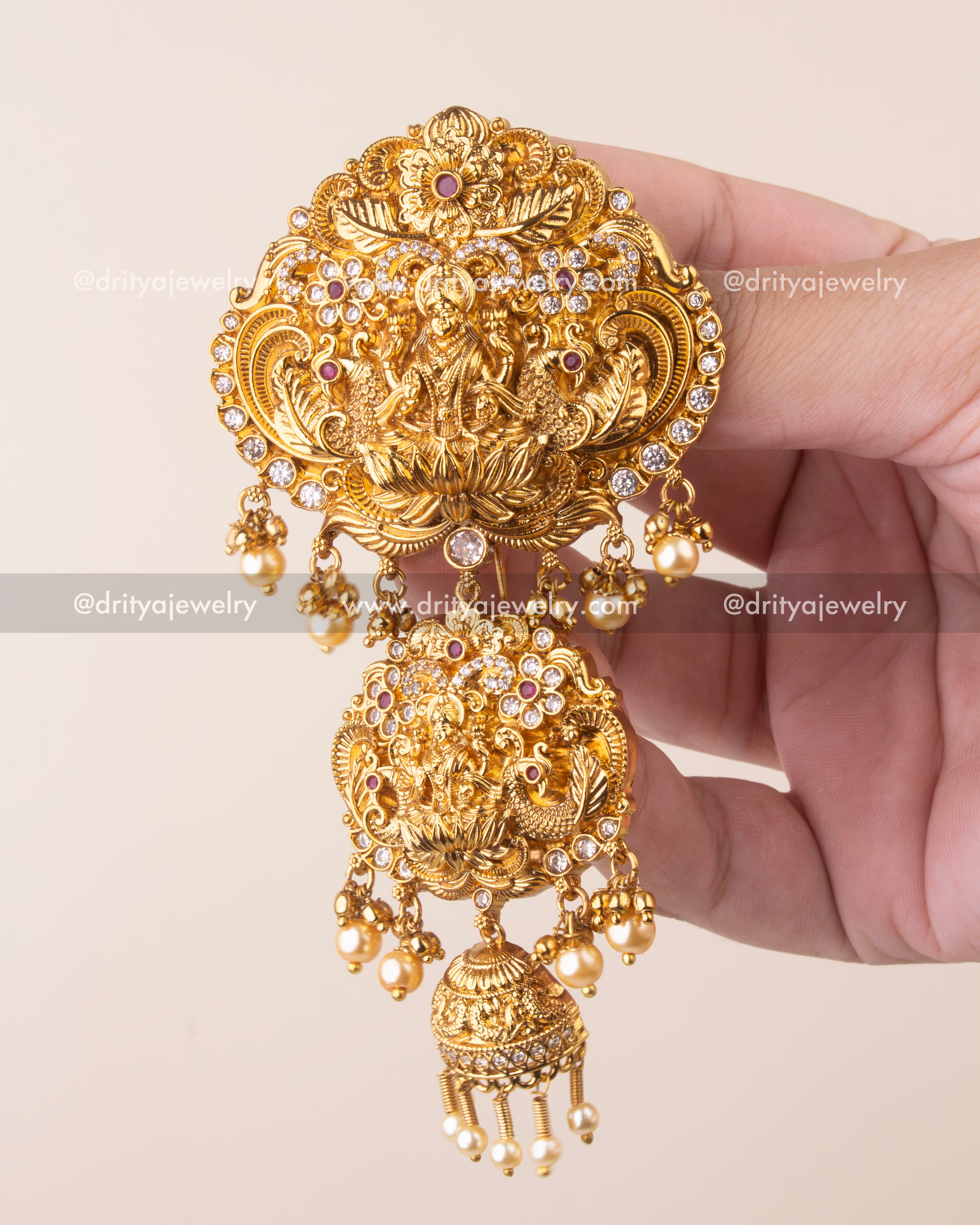 Gold-plated temple jewelry Jada Billa brooch featuring Goddess Lakshmi and pearl danglers.