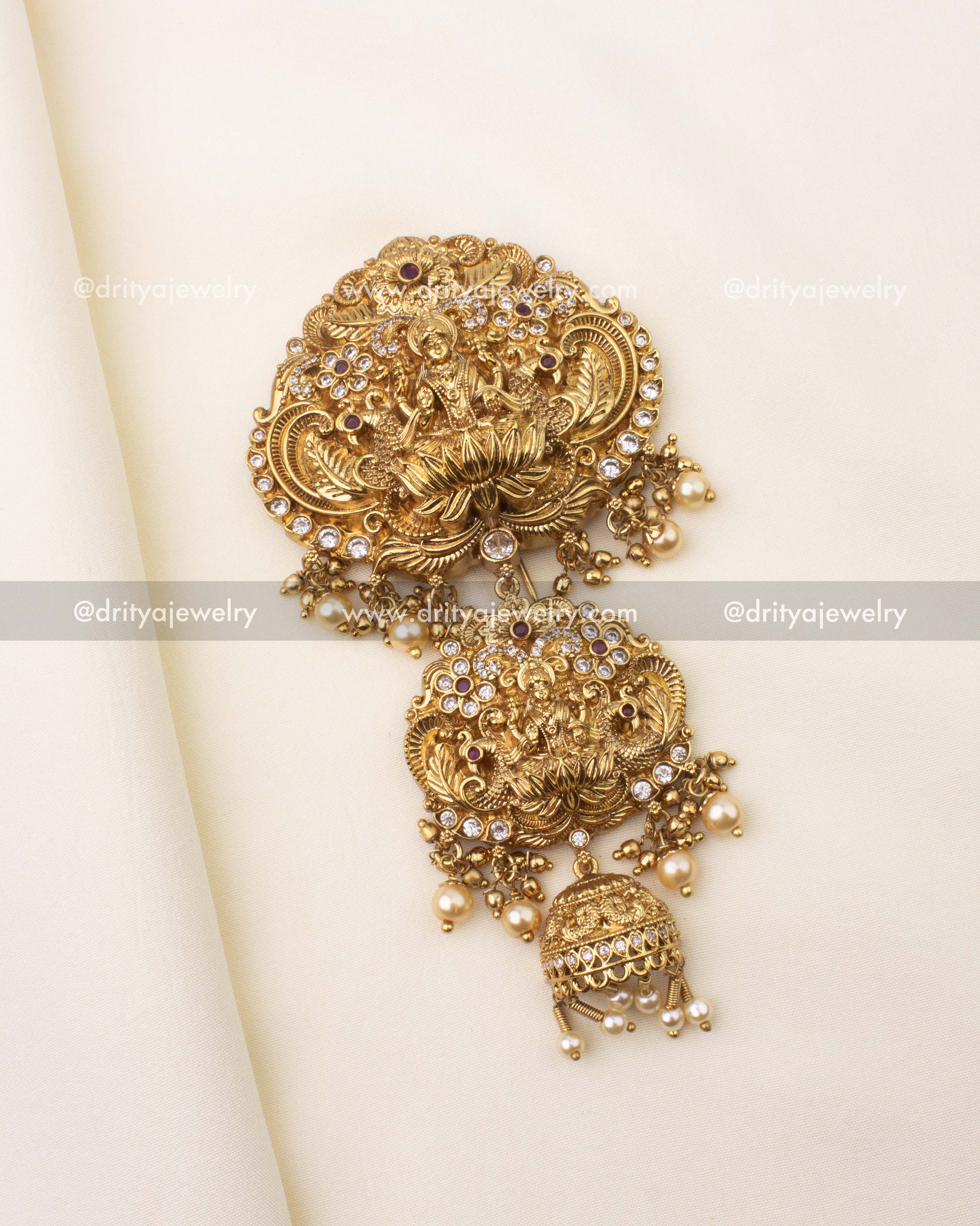 Gold-plated temple jewelry Jada Billa brooch featuring Goddess Lakshmi and pearl danglers.