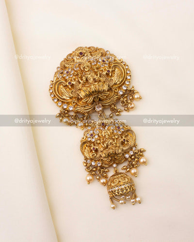 Gold-plated temple jewelry Jada Billa brooch featuring Goddess Lakshmi and pearl danglers.
