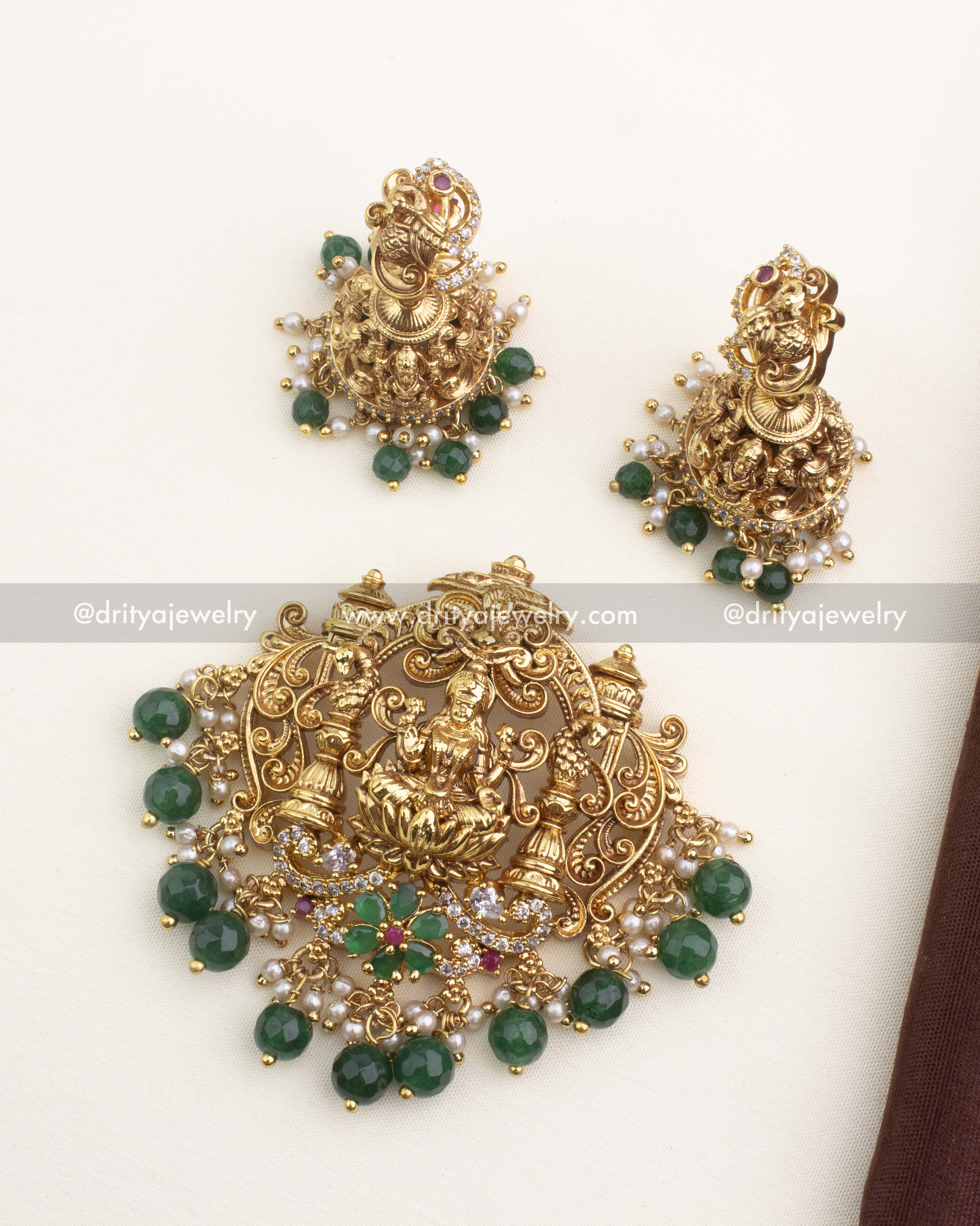 Complete temple nakshi pendant set with central deity pendant and matching peacock jhumkas.