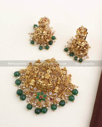 Complete temple nakshi pendant set with central deity pendant and matching peacock jhumkas.