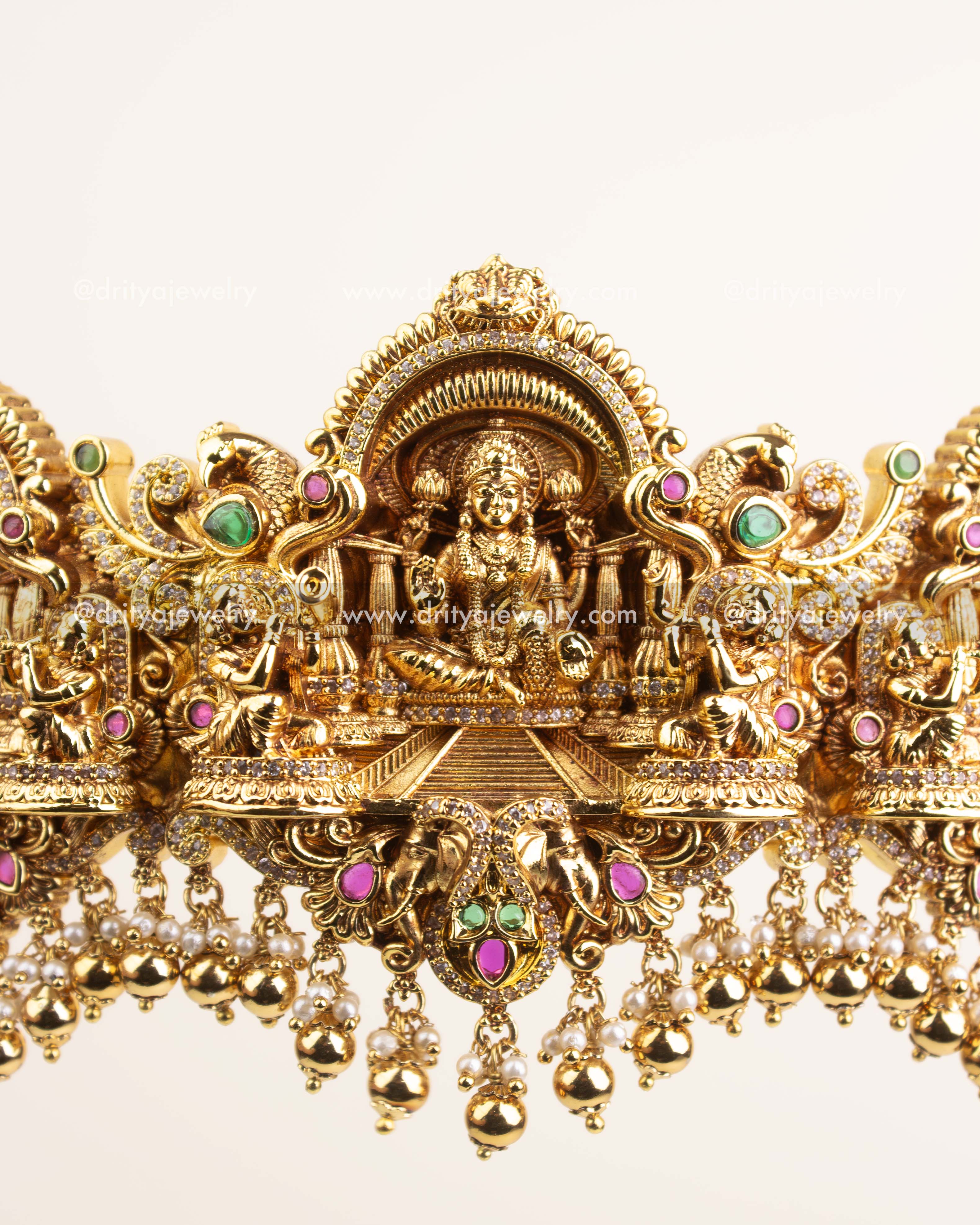 Detailed center featuring Goddess Lakshmi with ruby and emerald accents.