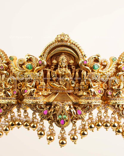 Detailed center featuring Goddess Lakshmi with ruby and emerald accents.