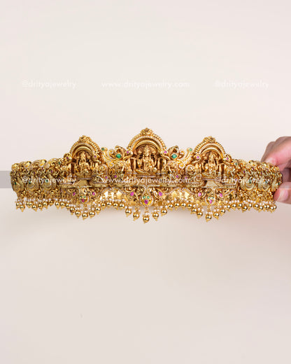 Antique gold temple vadanam with 3D Goddess Lakshmi motif and intricate Nakshi detailing.