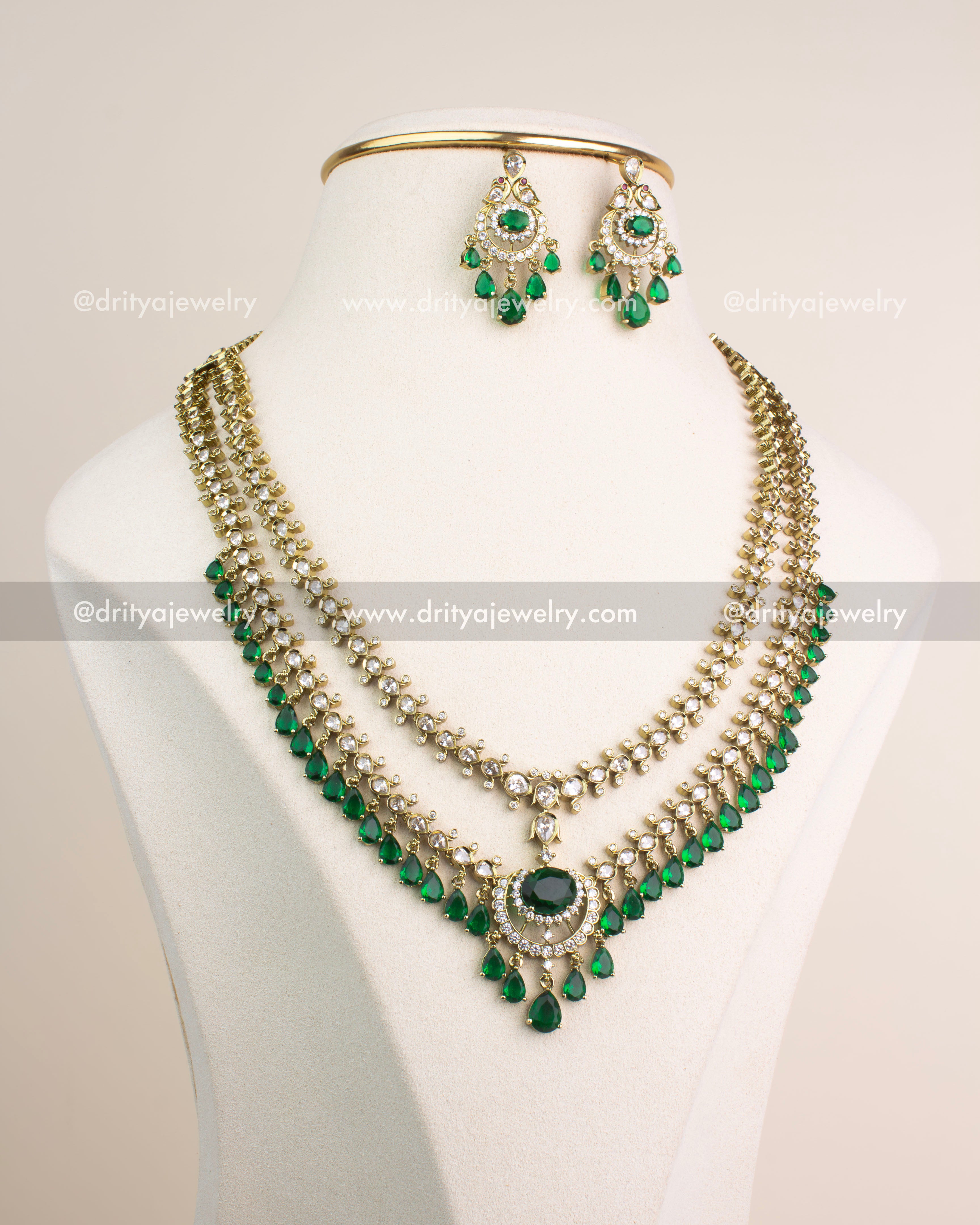 Victorian-style emerald green and CZ stone necklace set with matching earrings in dual-tone finish.