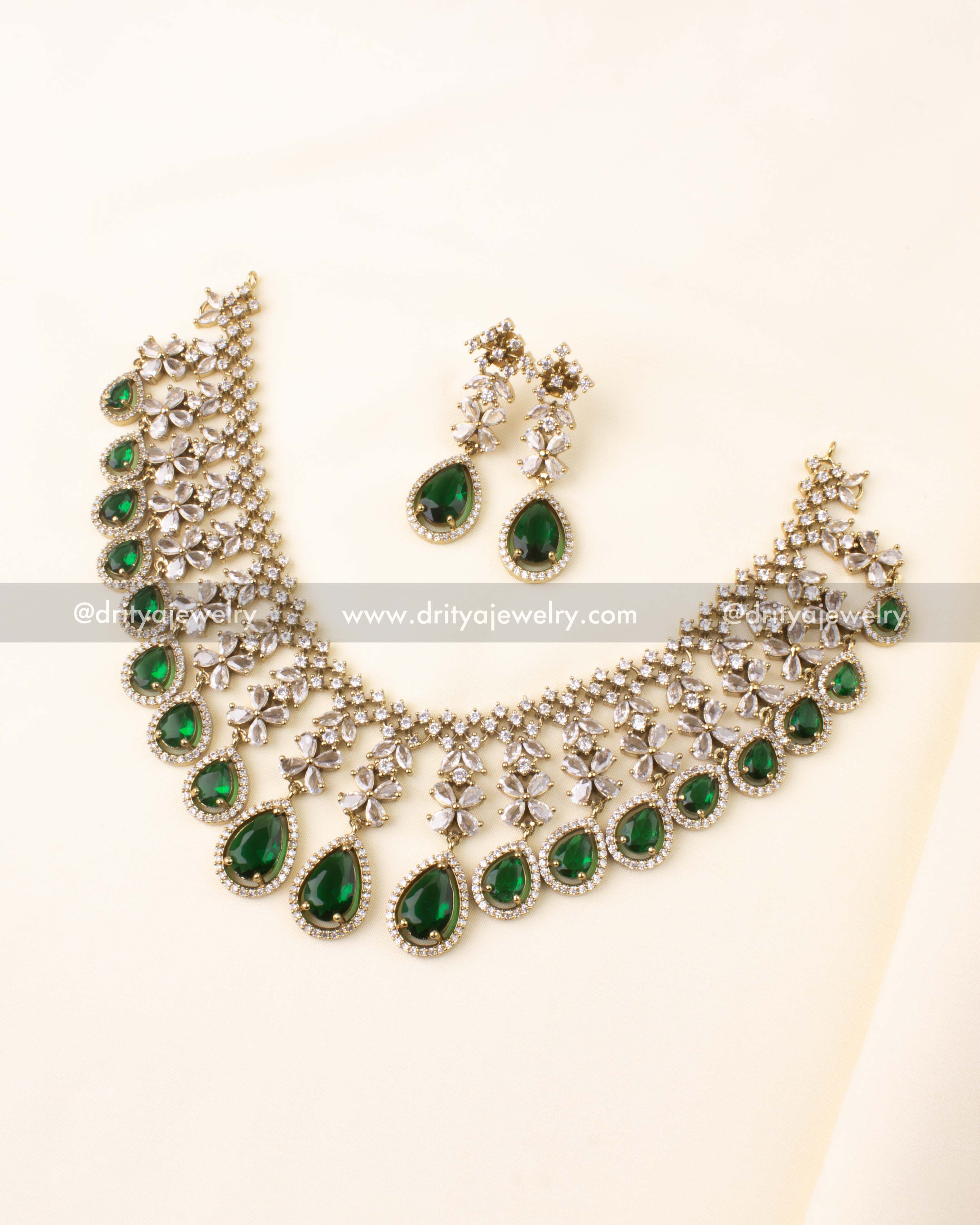 Victorian-style necklace set with emerald green stones and AD embellishments