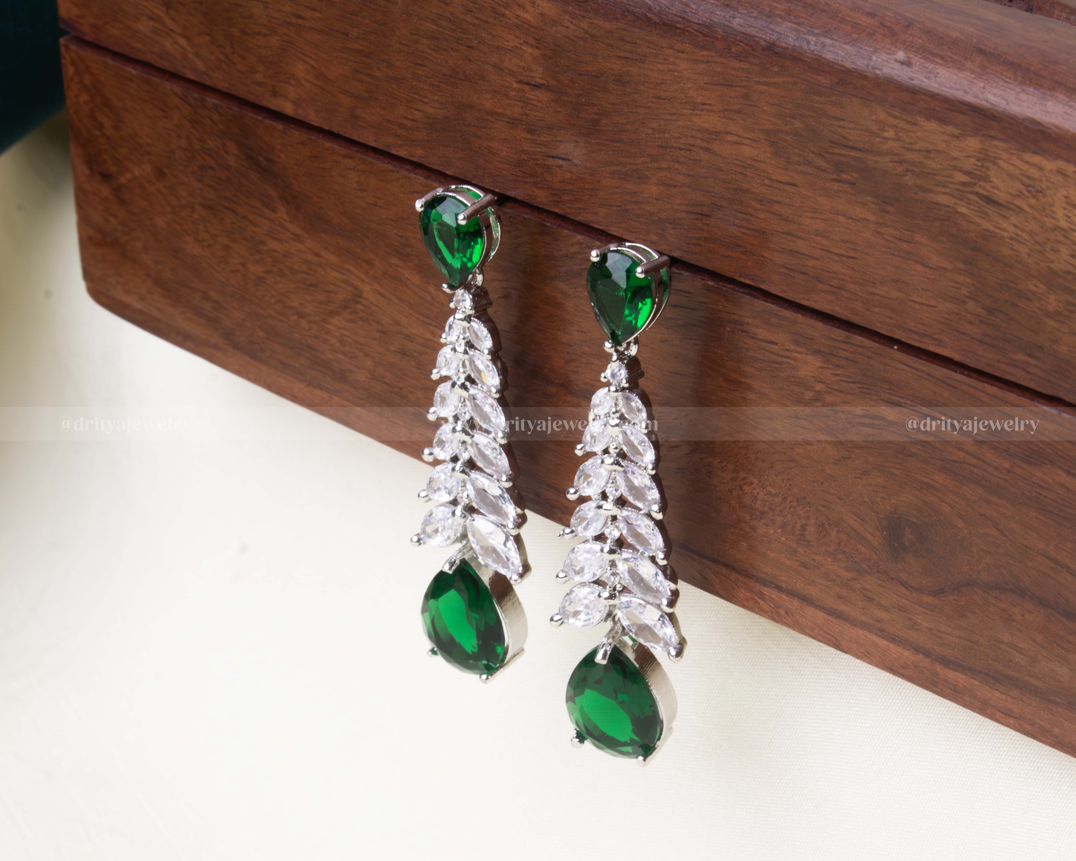 Premium emerald green zircon dangler earrings with cascading marquise stones and teardrop design.