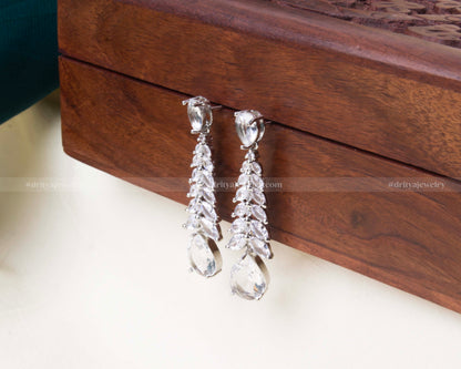 Premium white zircon dangler earrings with cascading marquise stones and teardrop finish.