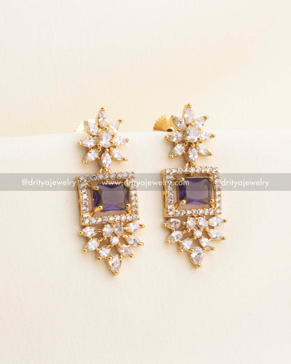 Earrings featuring purple square stone and delicate CZ floral clusters.