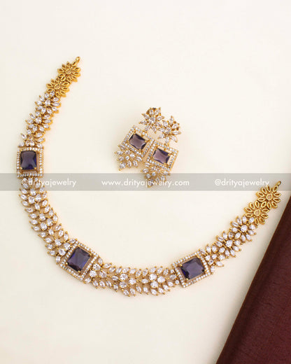 Necklace set with royal purple square stone centerpiece and CZ floral chain links, matching earrings included.