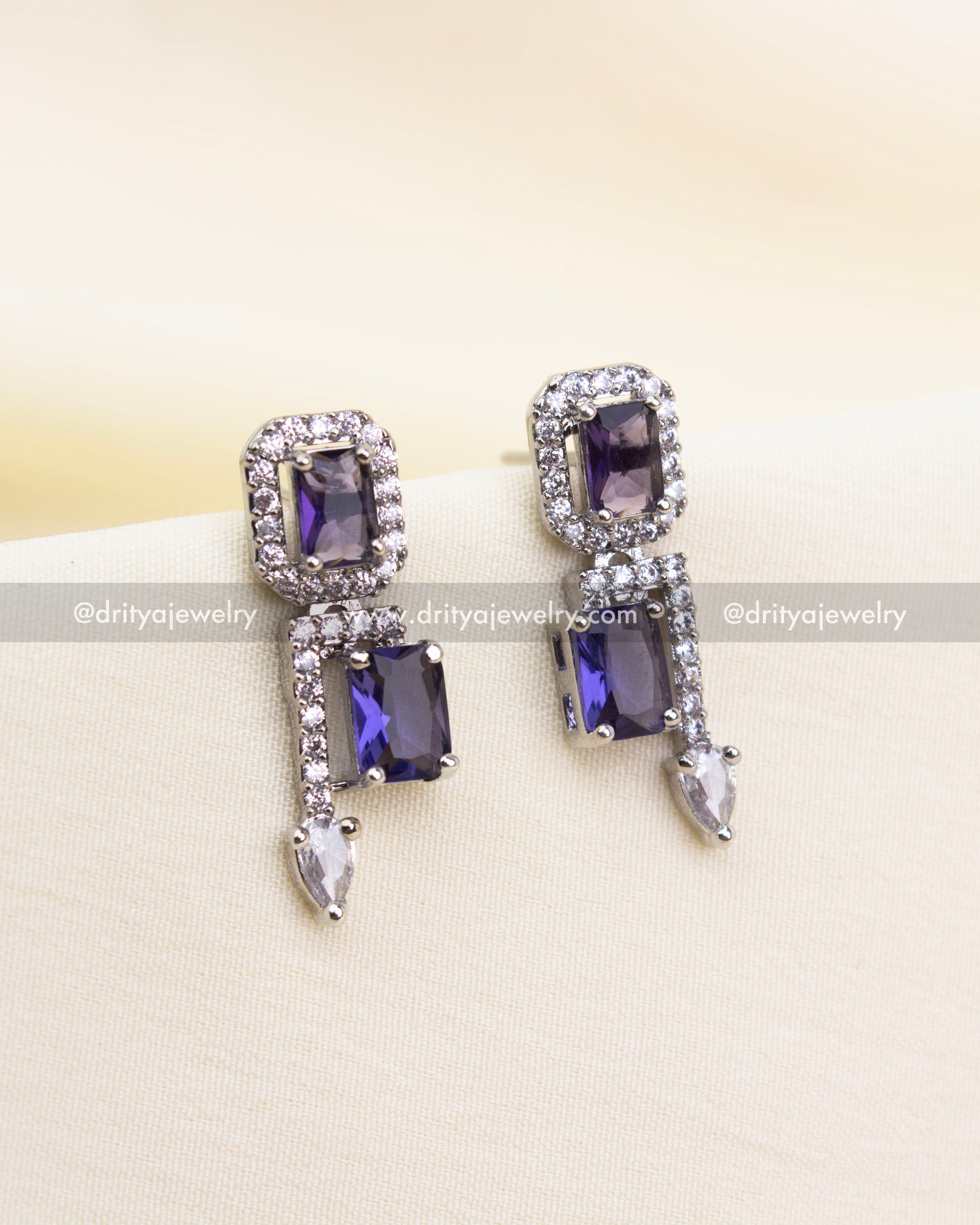 Triple-drop earrings with rectangular purple stones and teardrop crystals