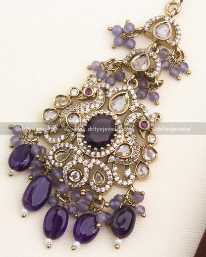 Close-up highlighting purple centerpiece, kundan polki stones, and antique Victorian detailing