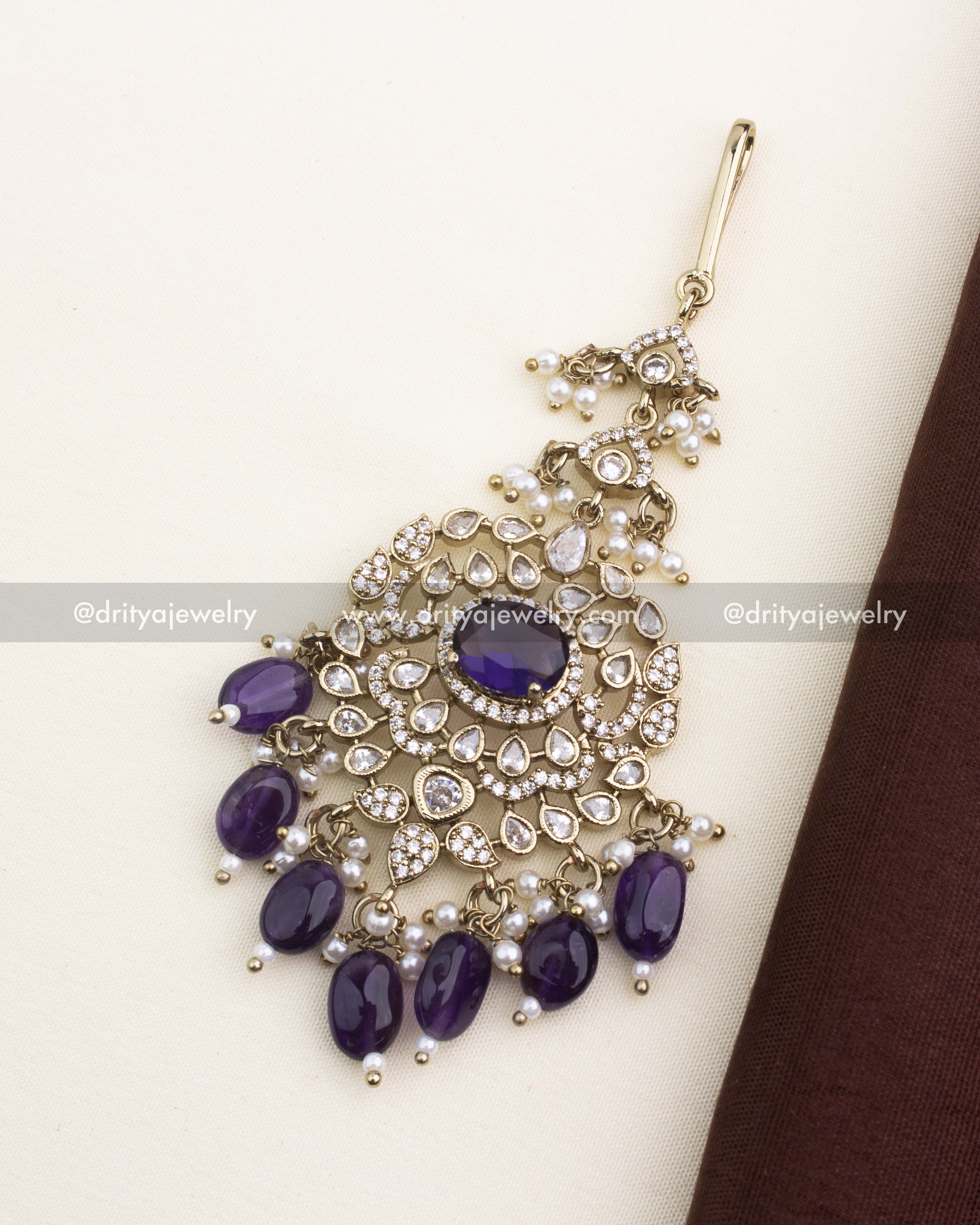 Antique Victorian maang tikka with deep purple center stone, teardrop AD stones, and pearl hangings.
