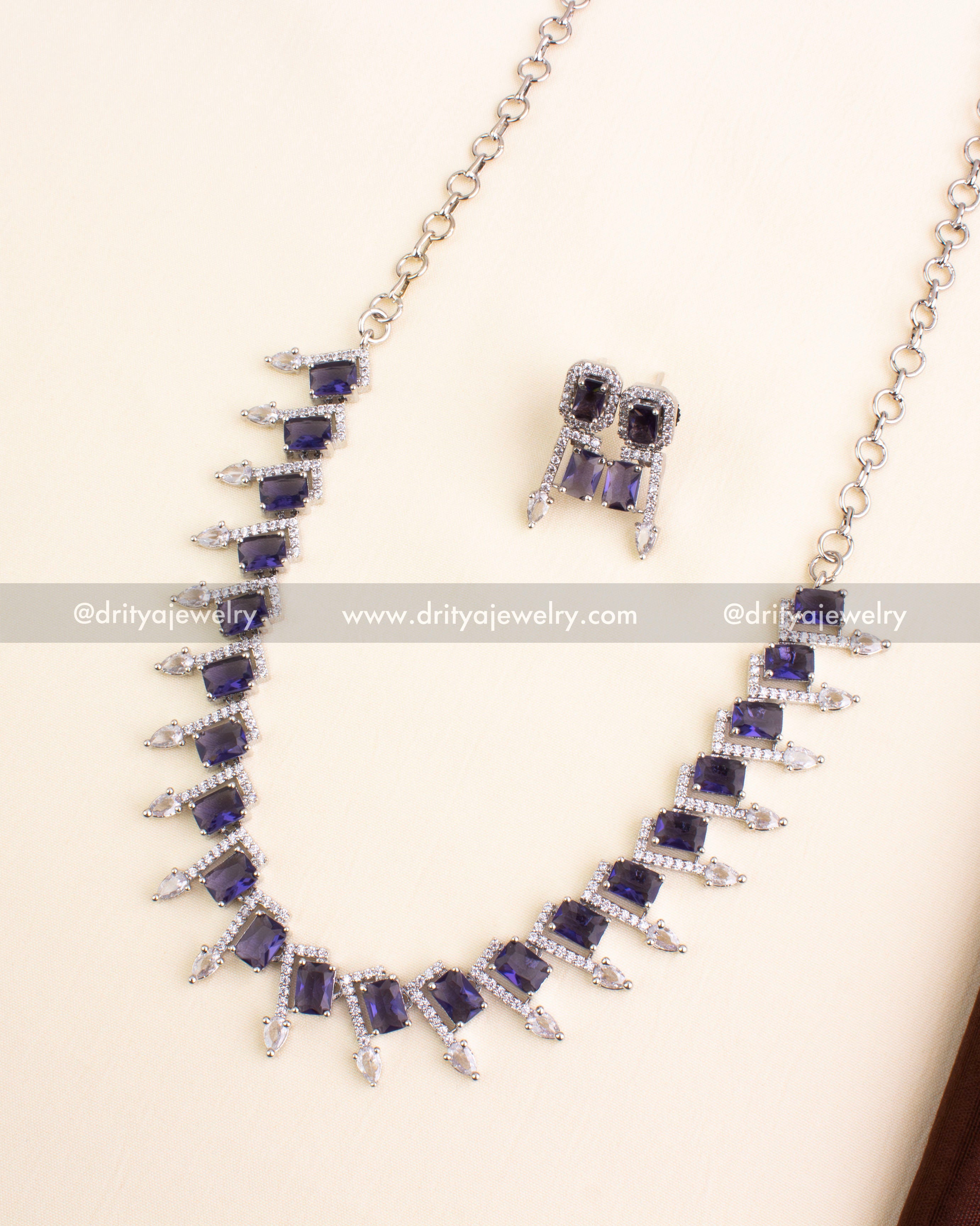 Purple stone necklace set in silver finish with matching earrings