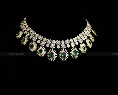 Full front view of the necklace displaying the elaborate design of CZ stones and emerald accents.