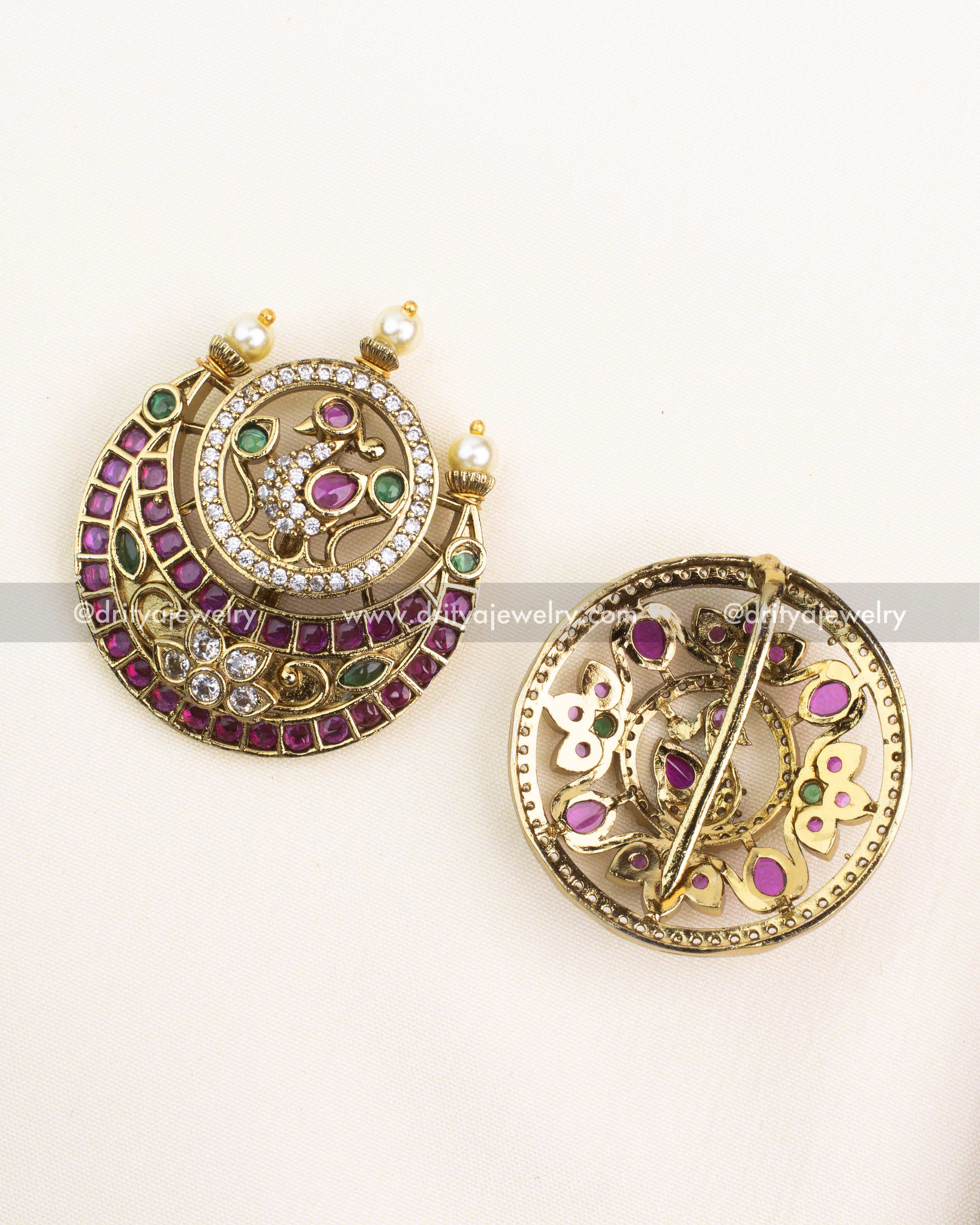 Traditional back design of antique hair pins showcasing ruby and emerald embellishments with secure locking mechanism.