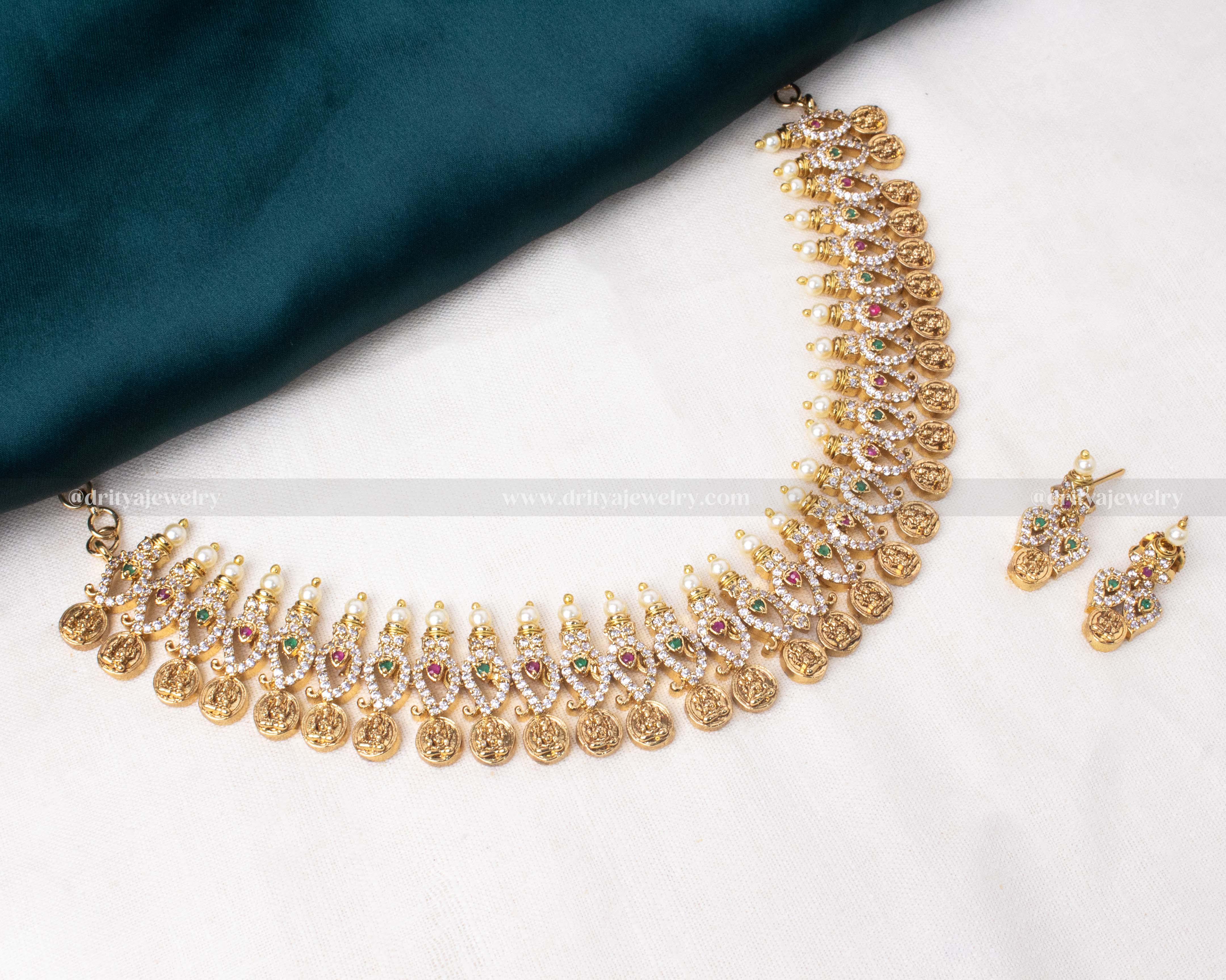 Traditional temple coin necklace adorned with pearls and multicolored gemstones, perfect for weddings and festive occasions.