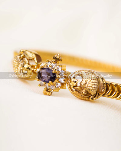 Zoomed-in view of purple centerpiece stone surrounded by white CZs.