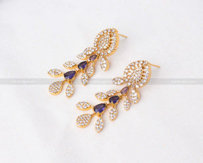 Elegant gold necklace set with purple and clear cubic zirconia stones, perfect for weddings and formal events.