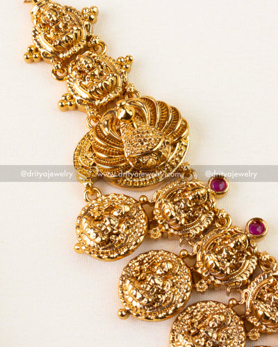 Detailed view of Nakshi haram featuring Lakshmi and peacock elements with temple polish.