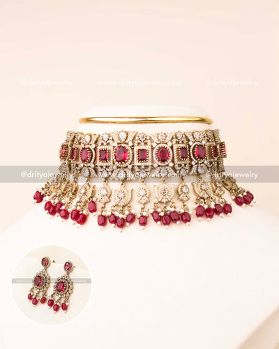 Luxurious ruby red bridal choker with AD stones and matching earrings.