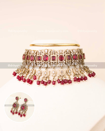 Luxurious ruby red bridal choker with AD stones and matching earrings.