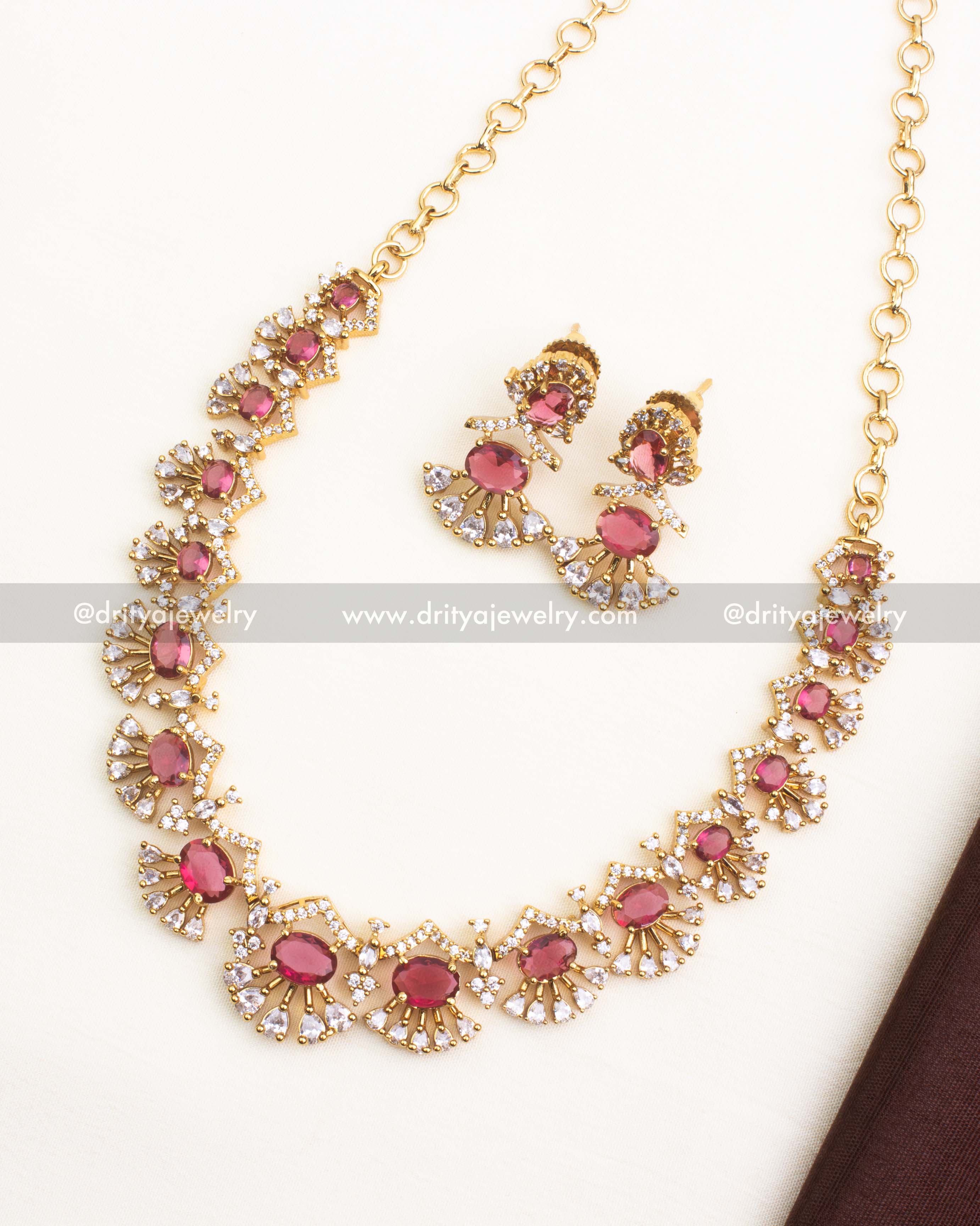 Premium ruby red short necklace set with CZ stones and radiant gold polish.
