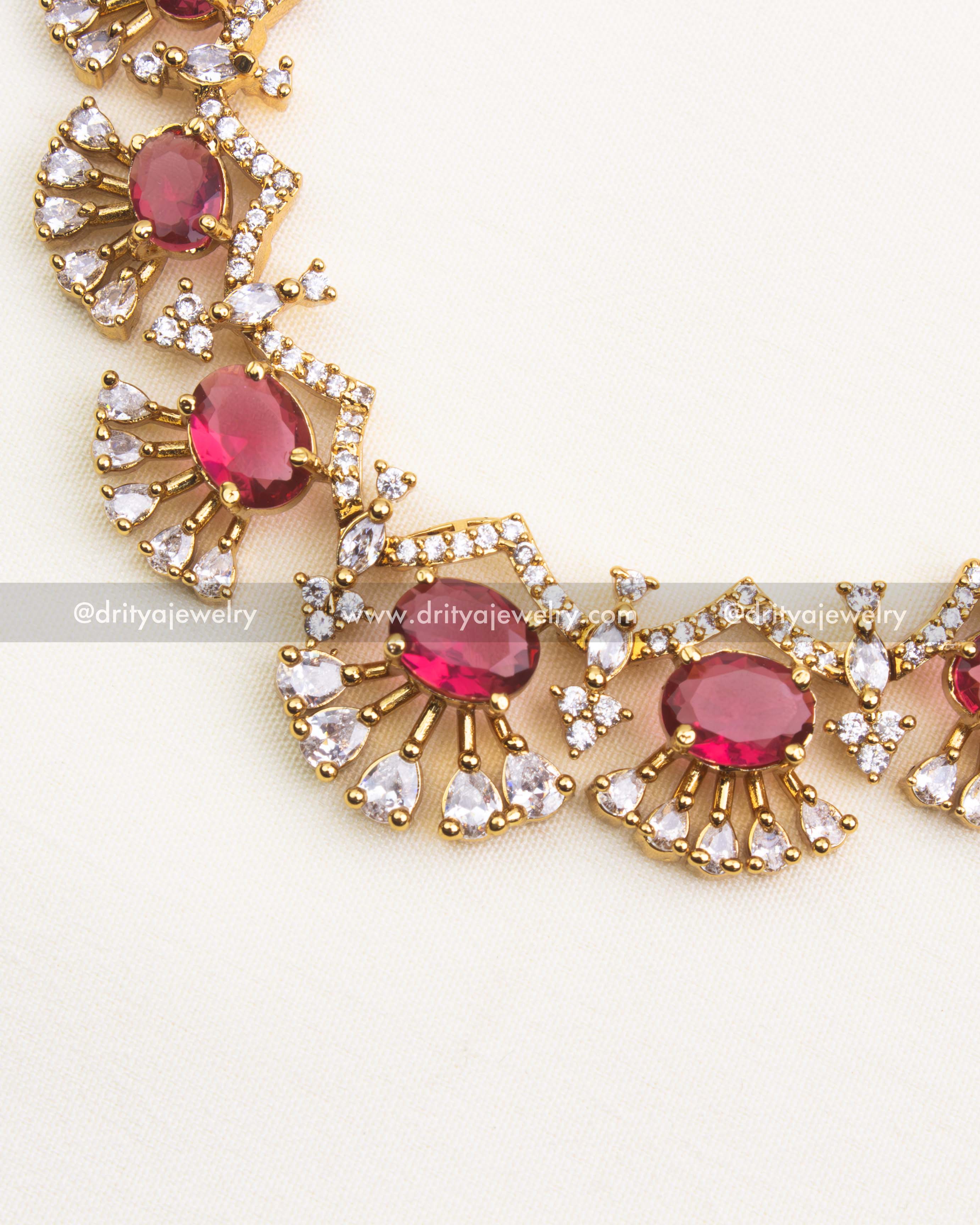 Premium ruby red short necklace set with CZ stones and radiant gold polish.