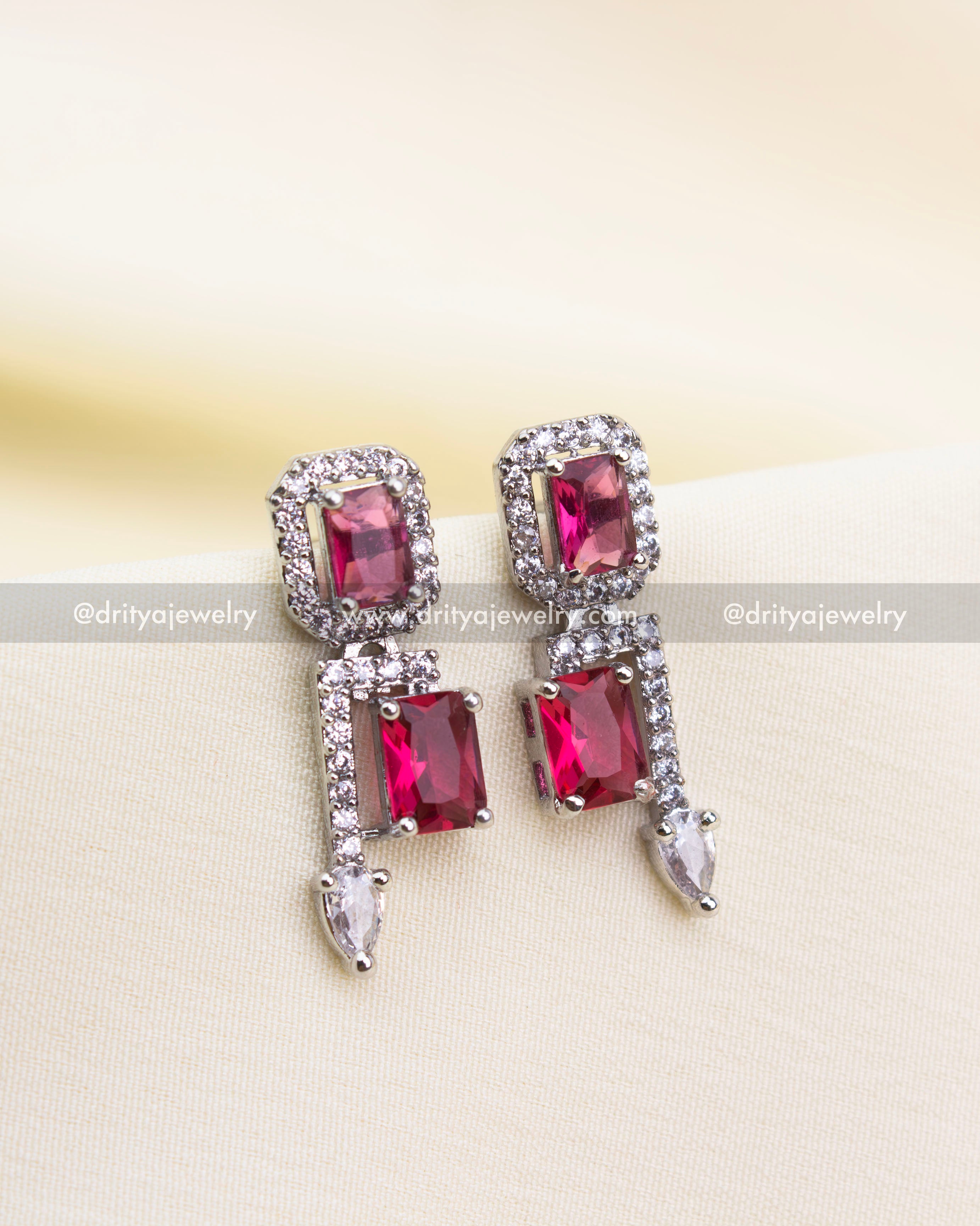Matching ruby red earrings with AD border and drop accents