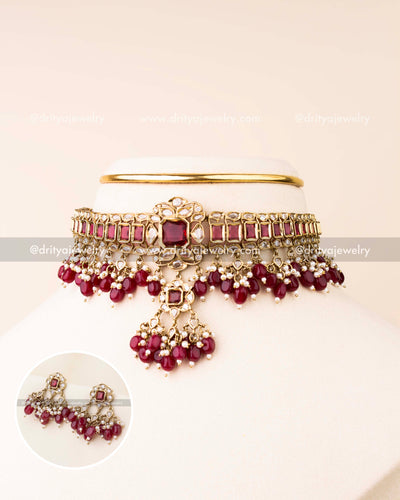 Premium choker necklace with ruby red stones, reverse AD detailing, and bead drops with matching earrings.
