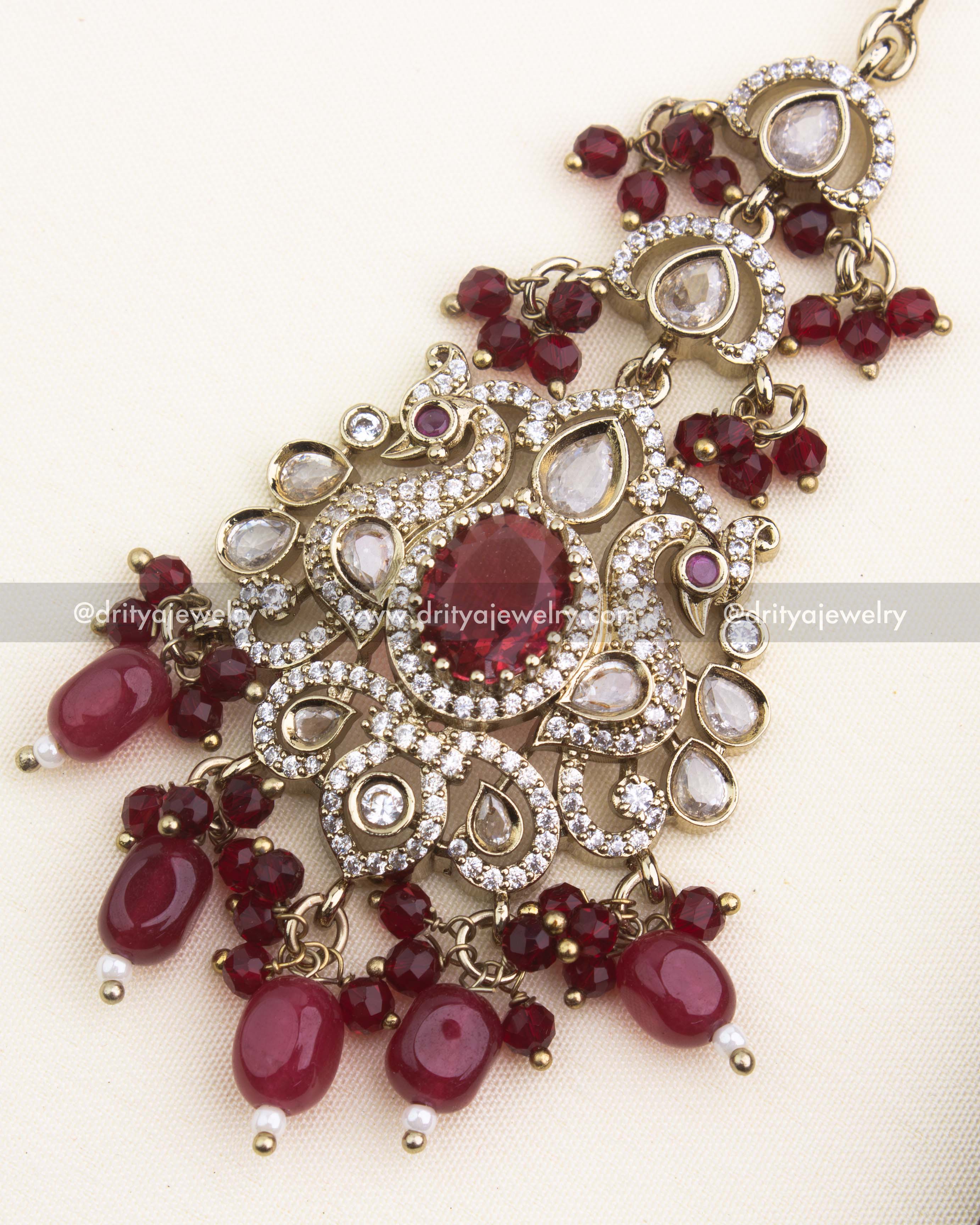 Close-up of red gemstone centerpiece with AD stones and Victorian craftsmanship