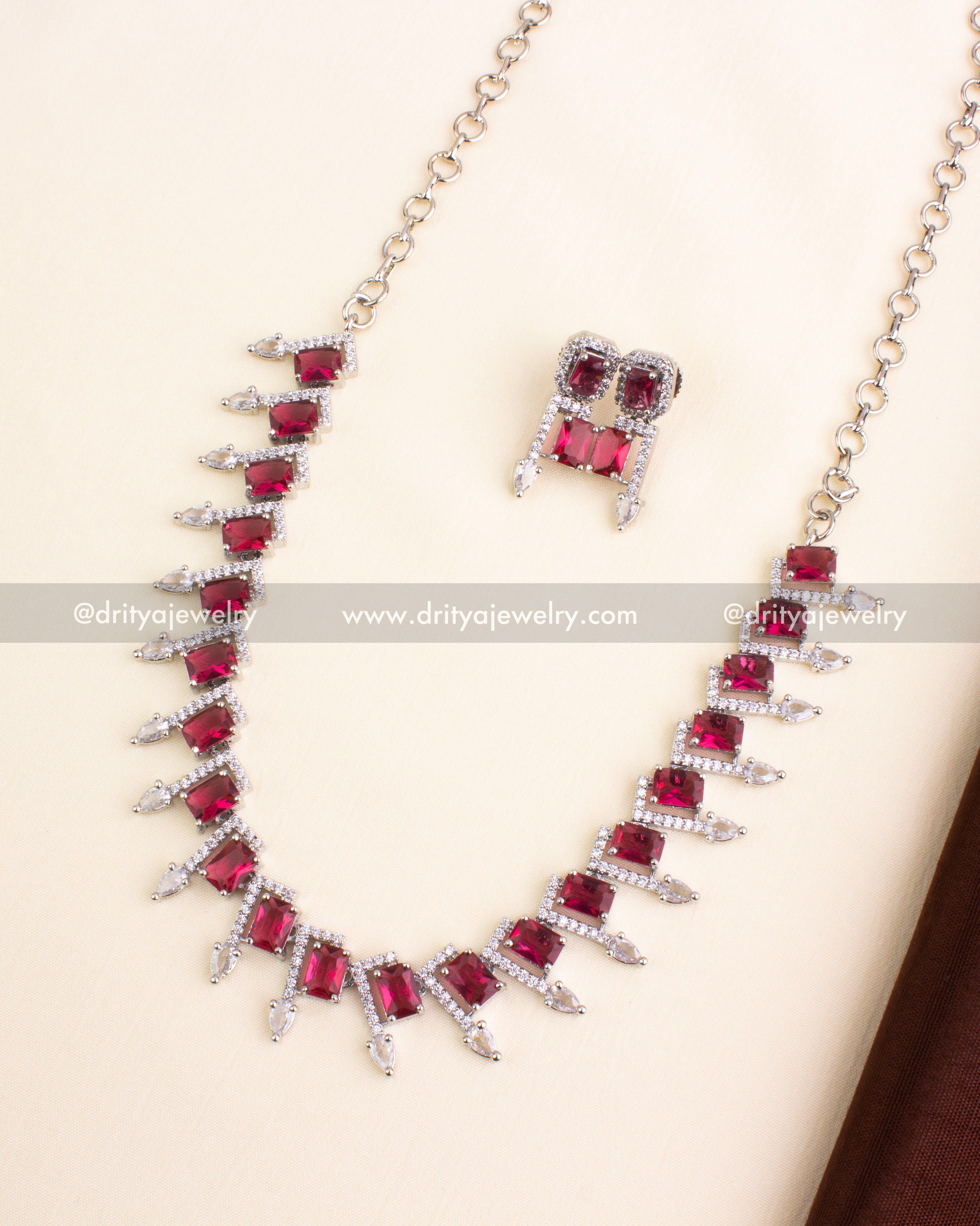 Short necklace set with ruby red stones and American Diamond embellishments