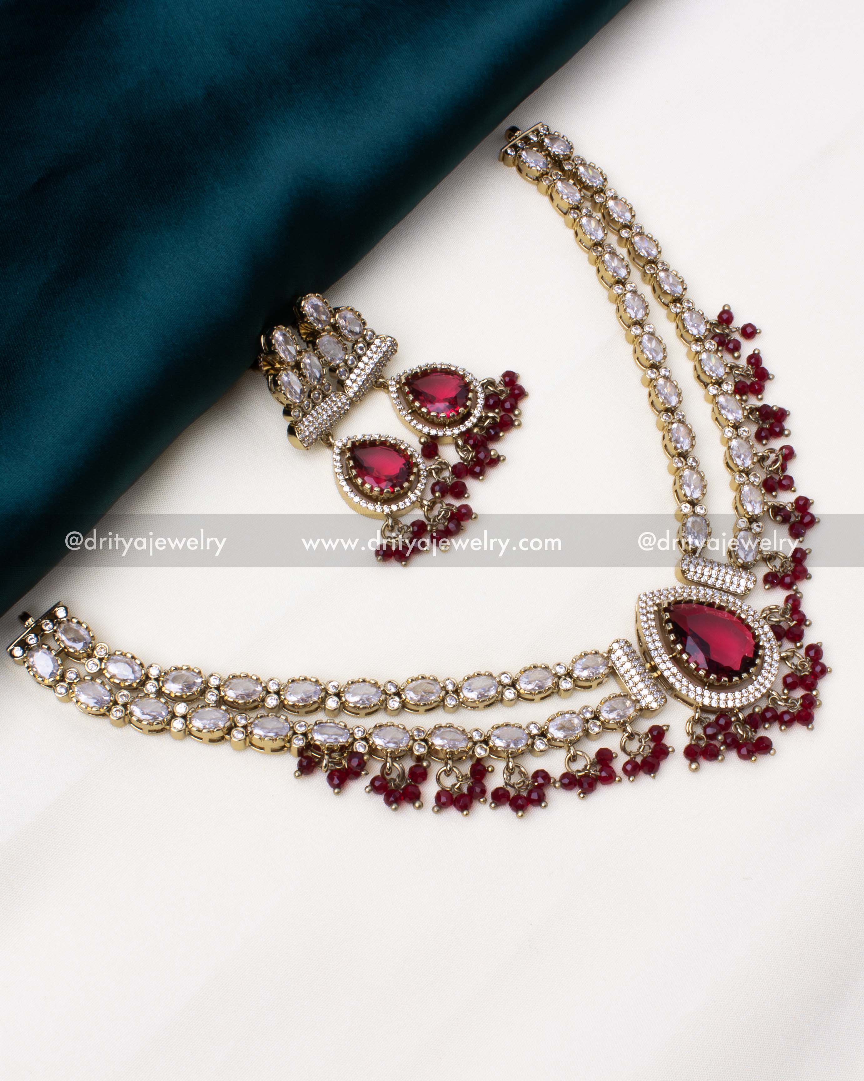 Short layered necklace set adorned with ruby crystal beads and antique Victorian polish.