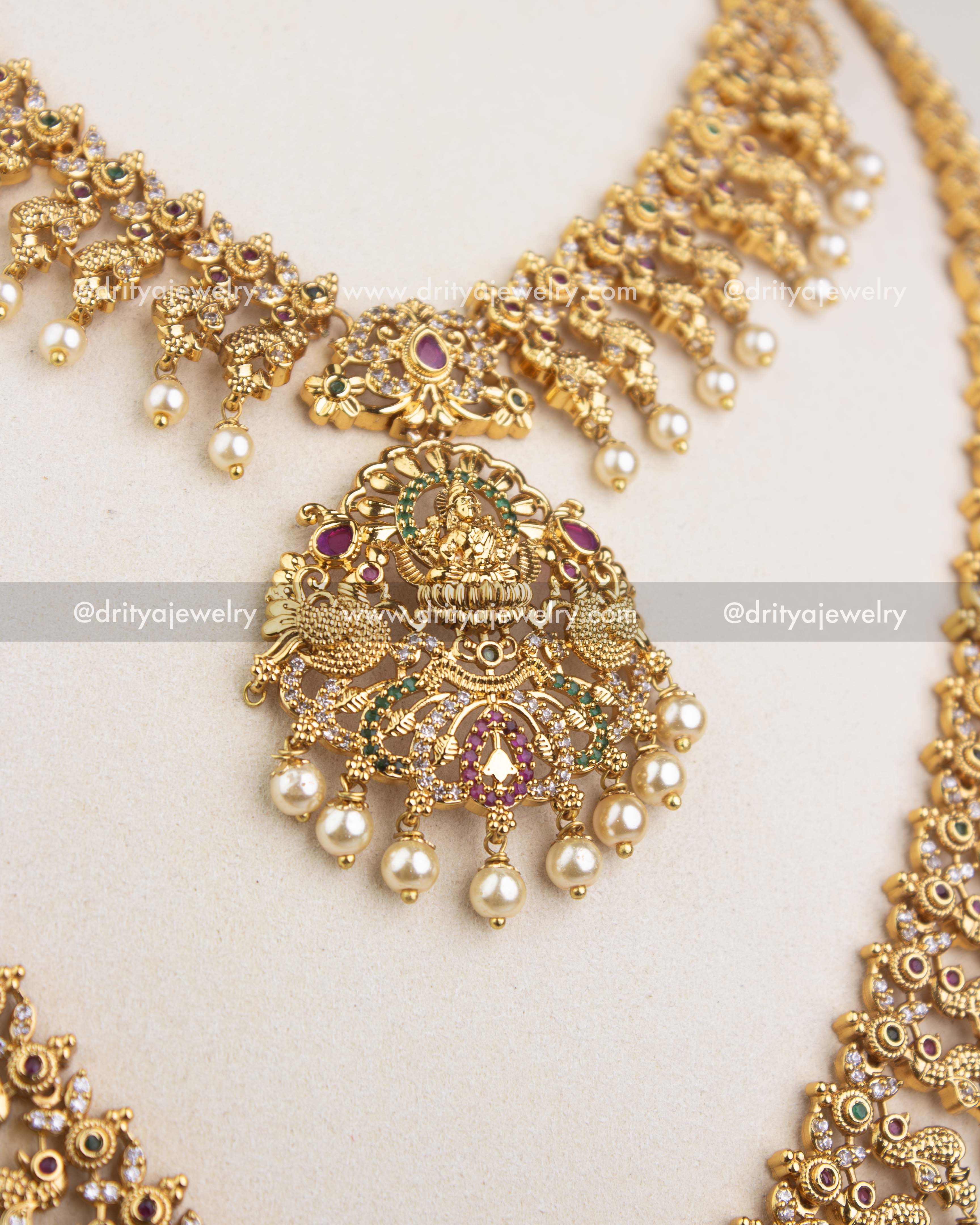 Traditional short necklace pendant with goddess motif and multi-color stones.