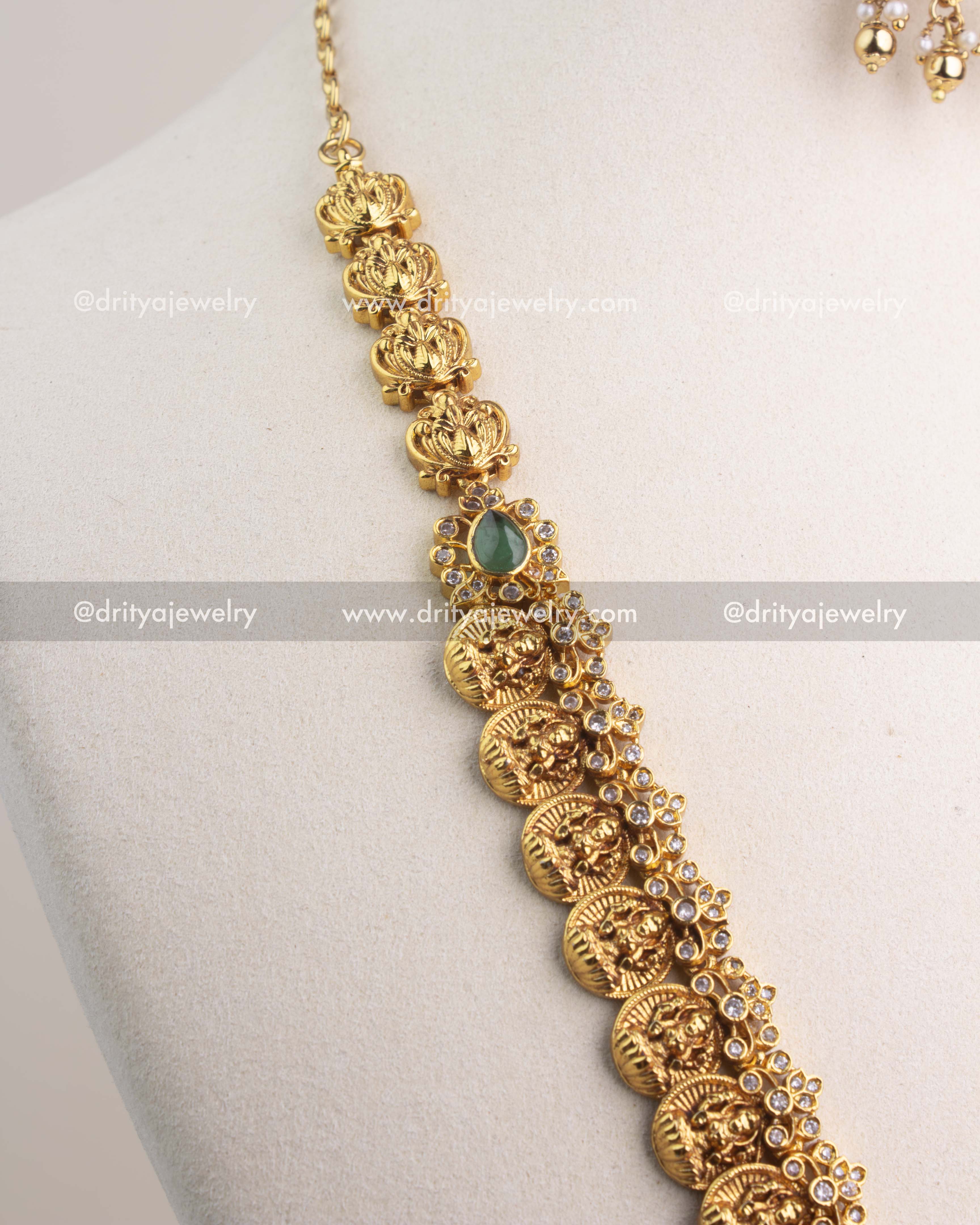 Temple-style gold finish chain with circular coin motifs and CZ embellishments.
