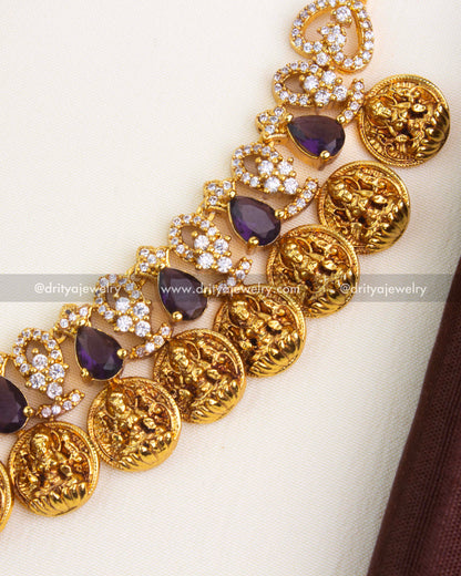 Alternating CZ vines and purple stones with handcrafted coin elements in temple jewelry style.