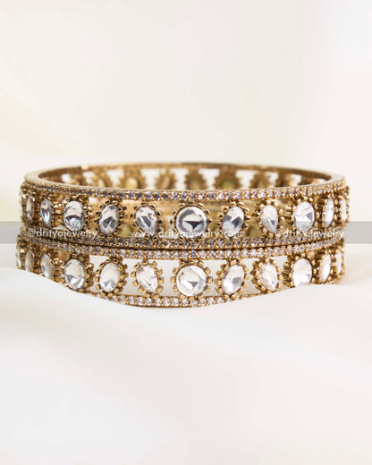 Side view showcasing dual rows of uncut Moissanite-style Polki stones with antique gold detailing.