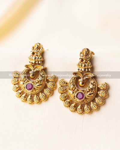 Traditional Nakshi earrings featuring floral and temple motifs in antique finish