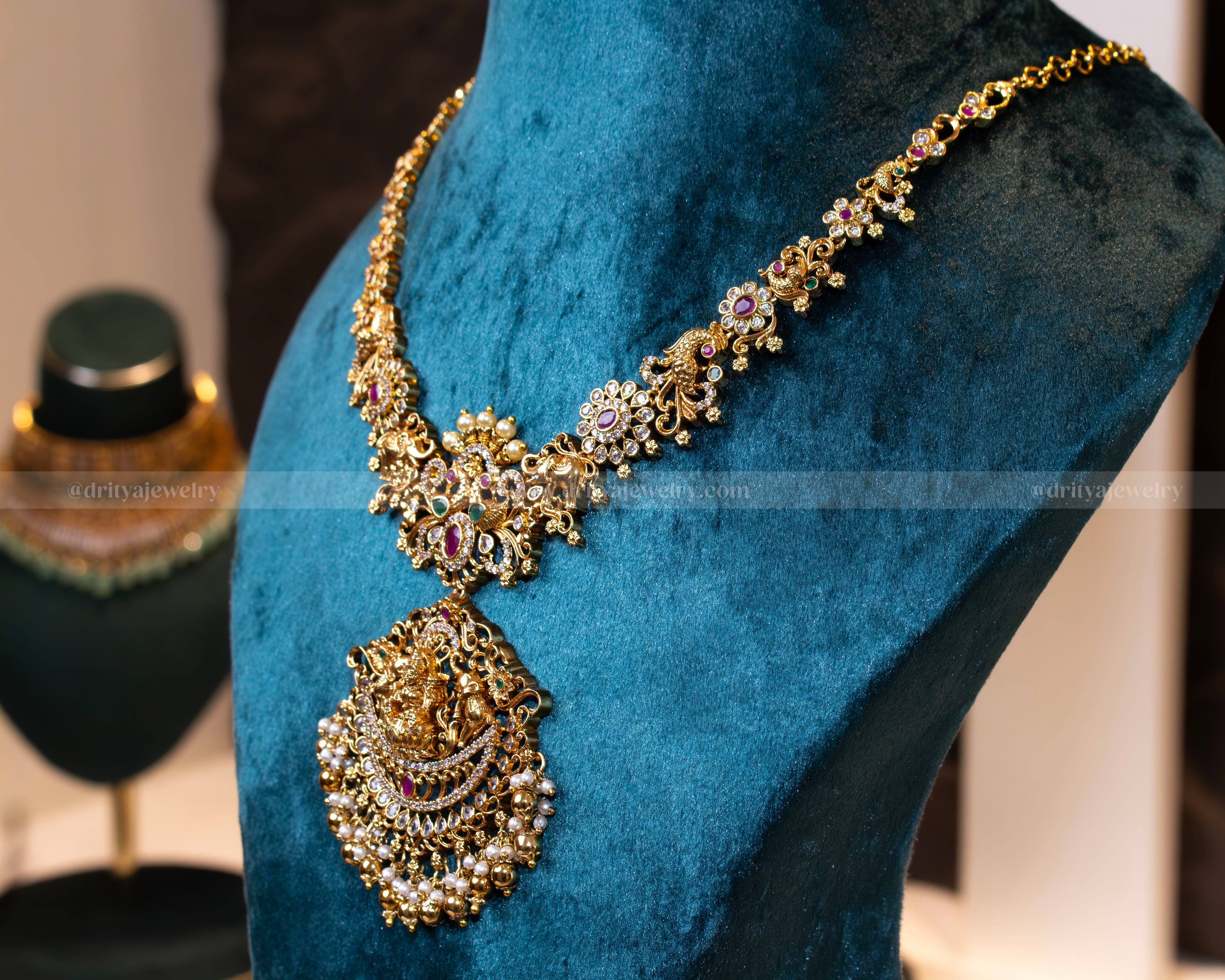 Side view of the Divine Lakshmi Devi Temple Necklace highlighting the detailed craftsmanship and elegant gemstone settings by Dritya Jewelry.