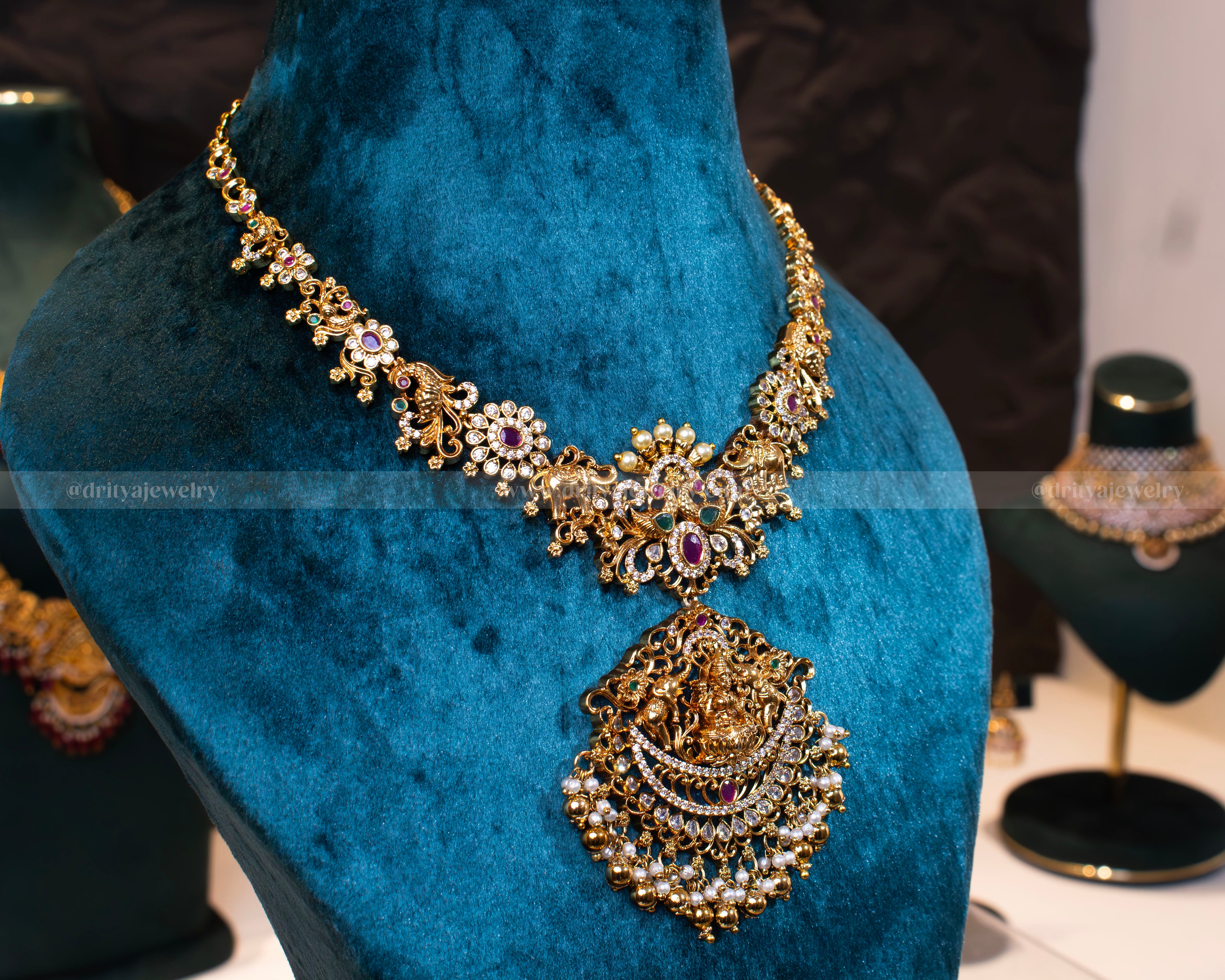 Side view of the Divine Lakshmi Devi Temple Necklace highlighting the detailed craftsmanship and elegant gemstone settings by Dritya Jewelry.