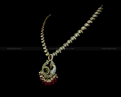 Side view of the Mehndi Victorian Necklace Set by Dritya Jewelry, featuring emerald and ruby stones with crystal detailing.