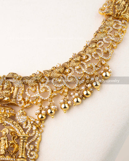 Exquisite Nakshi craftsmanship with peacock motifs, floral carvings, and CZ stone detailing.