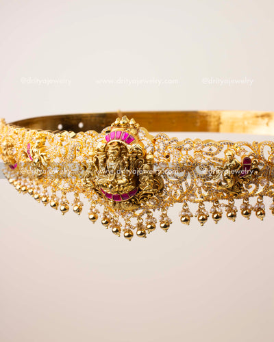 Close-up of nakshi detailing and CZ stone embellishments on traditional kemp temple vadanam